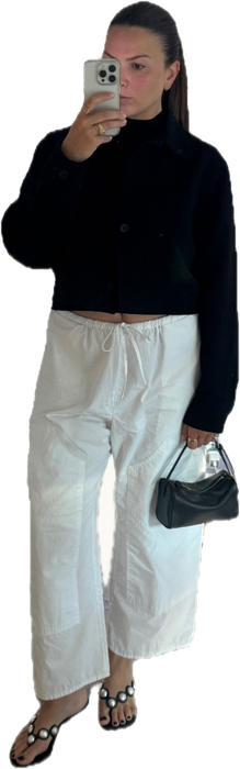 Look #0034: black jacket over a mock neck tank, white drawstring pants, black sandals, small black bag